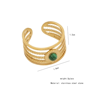 Detail view of gold layered hollow ring with green stone and dimension measurements