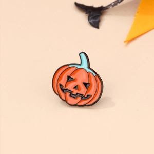 Detailed view of an orange pumpkin enamel pin with festive Halloween decorations