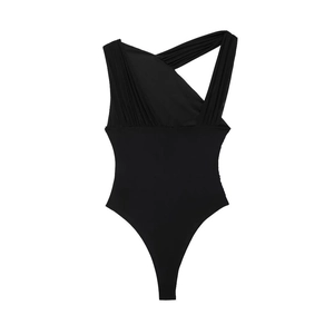 Detail of black asymmetric mesh bodysuit with cutout shoulder and pleated texture fabric