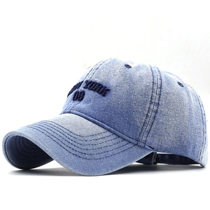 Classic washed denim baseball cap with New York embroidery in a 45-degree angle view