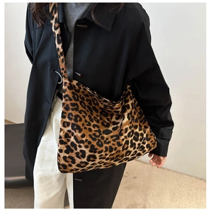 Detail of trendy leopard print tote bag with thick fabric texture for autumn fashion