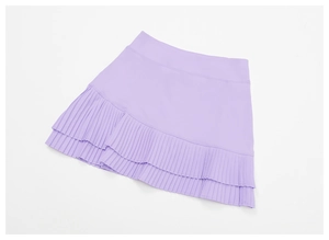 Detail of high waisted pleated sports skirt with inner liner in lavender color