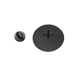 Close-up of matte black round metal pin back and rubber clutch for creative brooches
