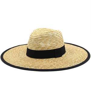 Classic straw sun hat with black ribbon and wide brim for summer beach travel