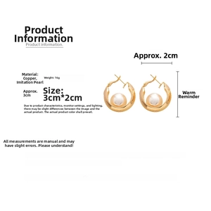 Detail view of gold-plated mesh hoop earrings with faux pearl and size dimensions