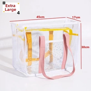 Detail of extra large waterproof PVC beach bag with pink straps and star patterns