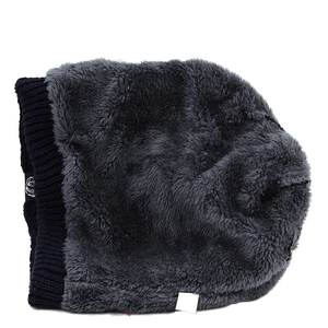 Detailed view of navy knit hat with thick dark grey faux fleece lining for winter