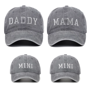 Detailed close-up of embroidered DADDY MAMA and MINI texts on washed cotton caps