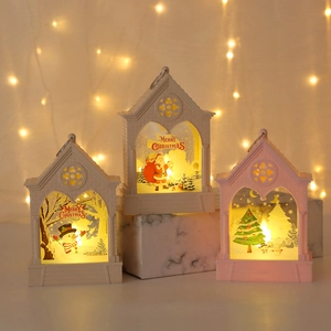 Christmas lantern ornaments with Santa and Snowman patterns on marble base with warm lights