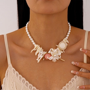 Resin shell geometric flower pearl necklace with bohemian style on female model