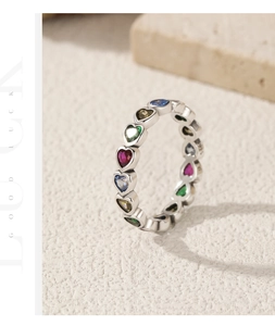 Macro view of S925 sterling silver ring featuring multi-colored heart-shaped gemstones