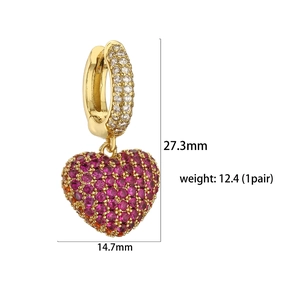 Detail showing dimensions 27.3mm x 14.7mm of gold heart earrings with pink stones