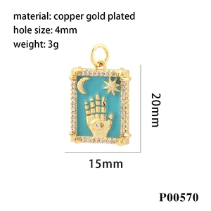 Detail view of 18k gold plated Fatima Hand pendant with turquoise enamel and zircons