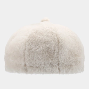 Close-up detail of soft cream plush faux fur texture on this stylish women's winter beret hat