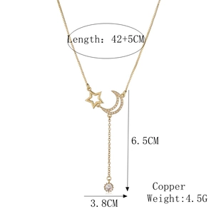 Detail of gold star and moon pendant necklace with size dimensions and copper material specs