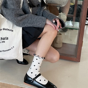 Japanese style white ruffle crew socks with black heart pattern and Mary Jane shoes