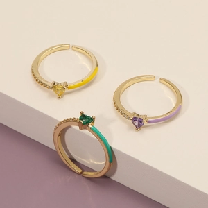 Three gold open rings with colorful heart gems, enamel details and micro-set zircons