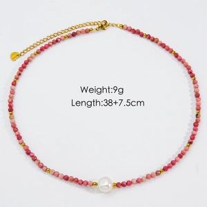 Macro detail of natural pink stone beads and baroque pearl necklace with gold clasp