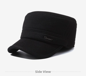 Detail of black wool flat top cap featuring sport metal badge and twill texture