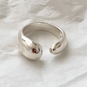 Detailed view of S925 sterling silver water drop ring with hallmark on white background