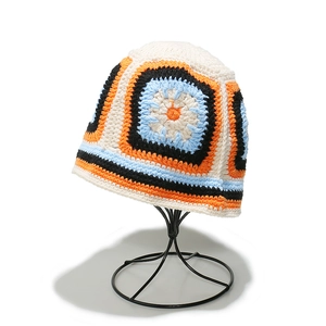 Handmade crochet granny square bucket hat with floral pattern in vibrant knit texture