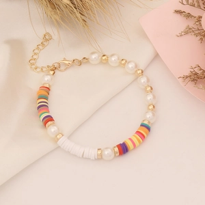 Detailed close-up of Bohemian beaded bracelet with colorful clay discs and pearls