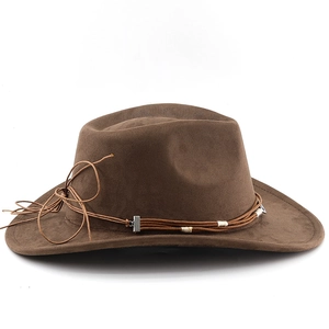 Detail of dark brown suede cowboy hat featuring woven leather band and silver metal buckle