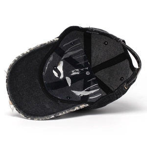 Black washed denim baseball cap with 3D embroidery and distressed ripped brim details