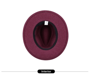 Detail of burgundy fedora hat interior with size 57 label and black sweatband