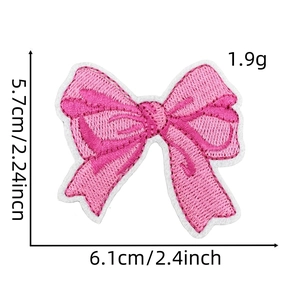 Detailed view of pink bow embroidered patch showing 6.1cm x 5.7cm size specifications