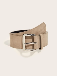 Detail of vintage wide suede waist belt in khaki with a polished silver metal buckle