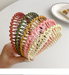 Close-up of matte nonslip wavy headbands in diverse Morandi colors for hair styling