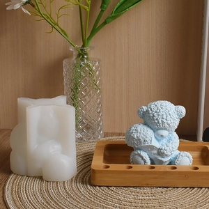 Macro detail of 3D teddy bear silicone mold showing intricate fur texture and blue wax finish