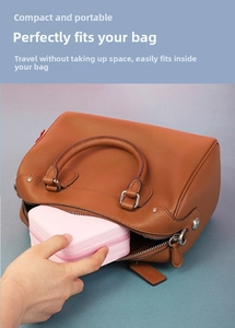 Pink mini portable jewelry box being placed into a bag showing its compact size