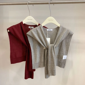 Detailed knit wool blend shawls in deep red and grey with decorative front knot detail
