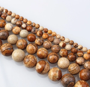 Close-up of natural map stone beads in various sizes for DIY jewelry making