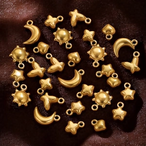 Golden stainless steel mini pendants in sun, moon, and heart shapes for DIY jewelry making