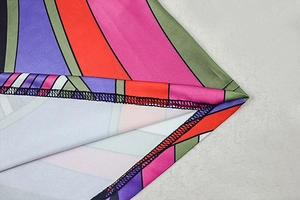 Macro shot of colorful geometric stripe print fabric and high-quality edge stitching details