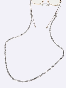 Close-up of silver metal eyeglasses chain with oval links and clear silicone loops