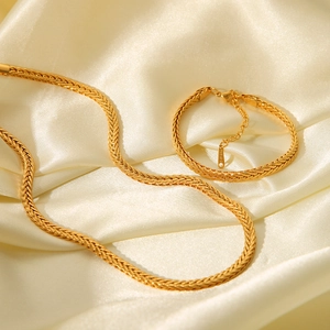 Detailed close-up of 18K gold-plated stainless steel woven wheat chain jewelry set
