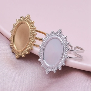 Macro shot of oval DIY ring bases in gold and silver with vintage beaded edges and open bands