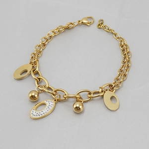 Detail of 18K gold-plated oval pendant bracelet with sparkling white rhinestones