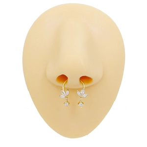 Detailed view of gold leaf nose ring with zirconia dangles on a realistic nose model