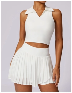 Close-up of white polo neck crop top and pleated tennis skirt set for women fitness