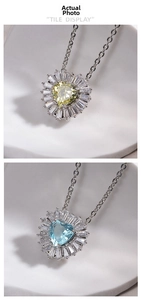 Macro shot of heart-shaped blue and yellow zircon pendant with halo setting on O-chain