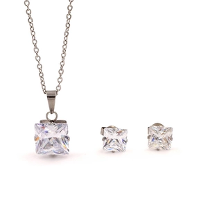Detail of square zircon pendant and stud earrings set in minimalist silver finish