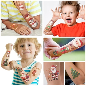 Detailed views of Christmas themed temporary tattoos for kids with Santa and reindeer designs