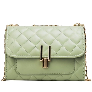Chic mint green quilted crossbody bag with golden chain strap and Y-shaped metal lock