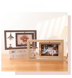 Detail of 360-degree rotating wood photo frame with warm home decor elements