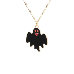Cute Halloween ghost necklace with black enamel pendant and golden chain on white background